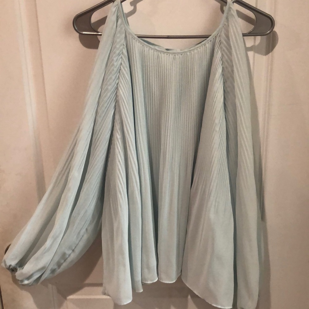Light aqua ruffly shirt